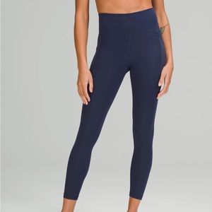 Dark blue lulu lemon leggings. 6. Hole in knee(very small).
